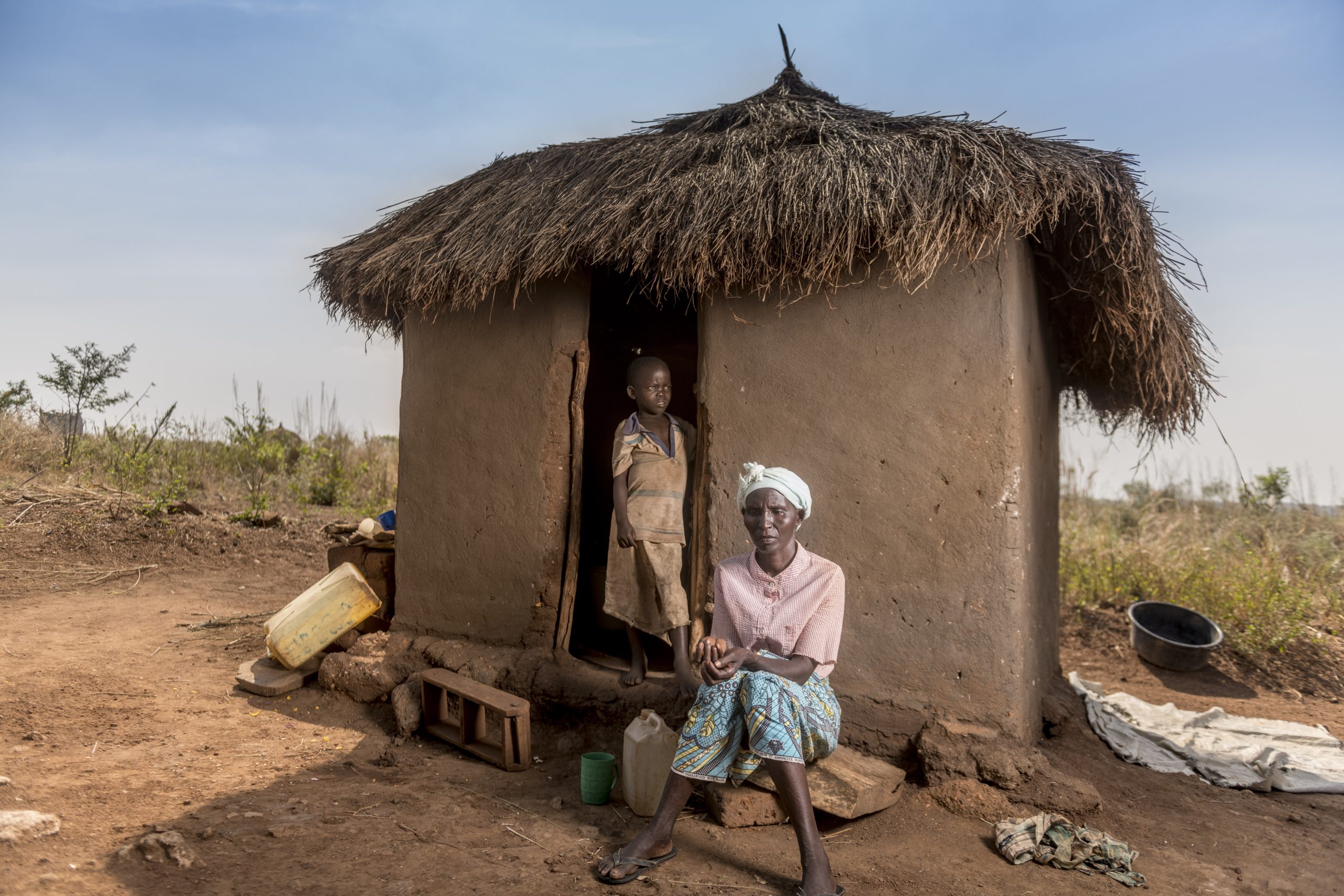 Uganda. Margaret, a refugee from South Sudan, outside her house with her 2 months of food rations